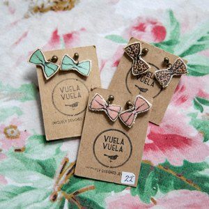 Three pairs of bow tie stud earrings pastel colors